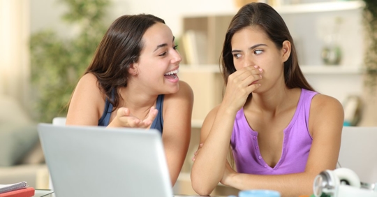 Woman covering her nose from bad breath