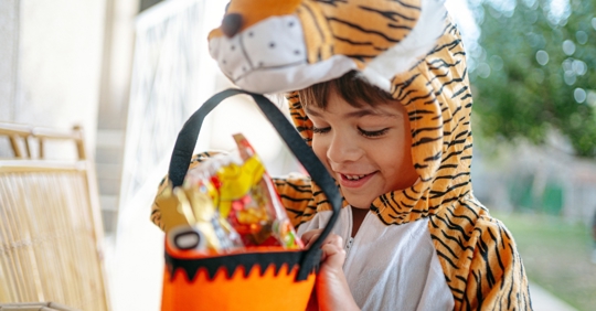 Kid with Halloween candy